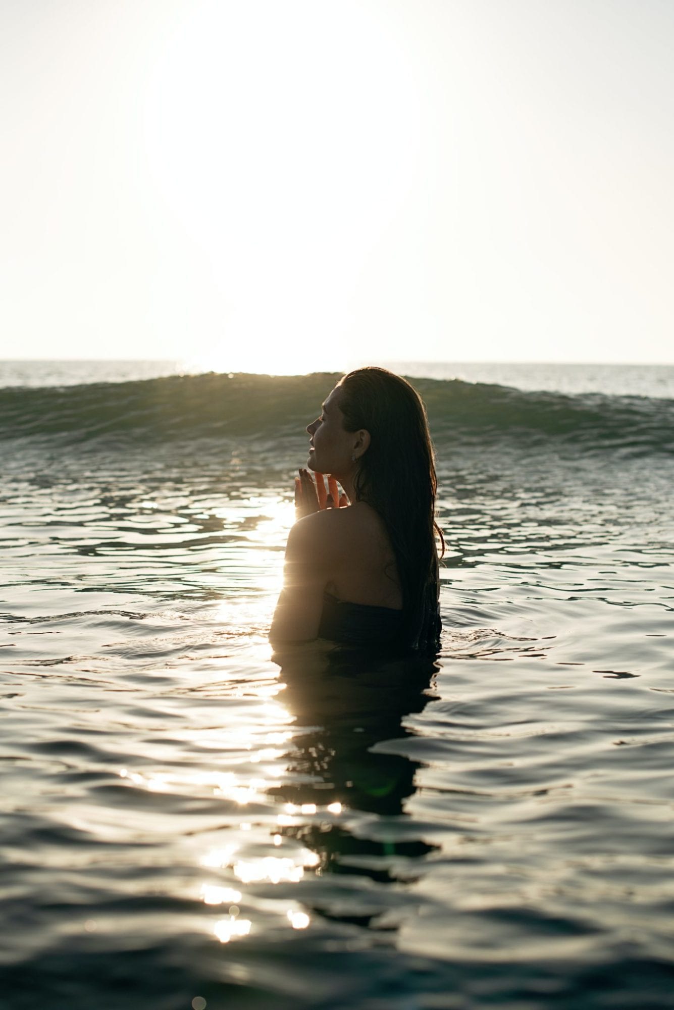 Image of woman in ocean focused and enjoying life